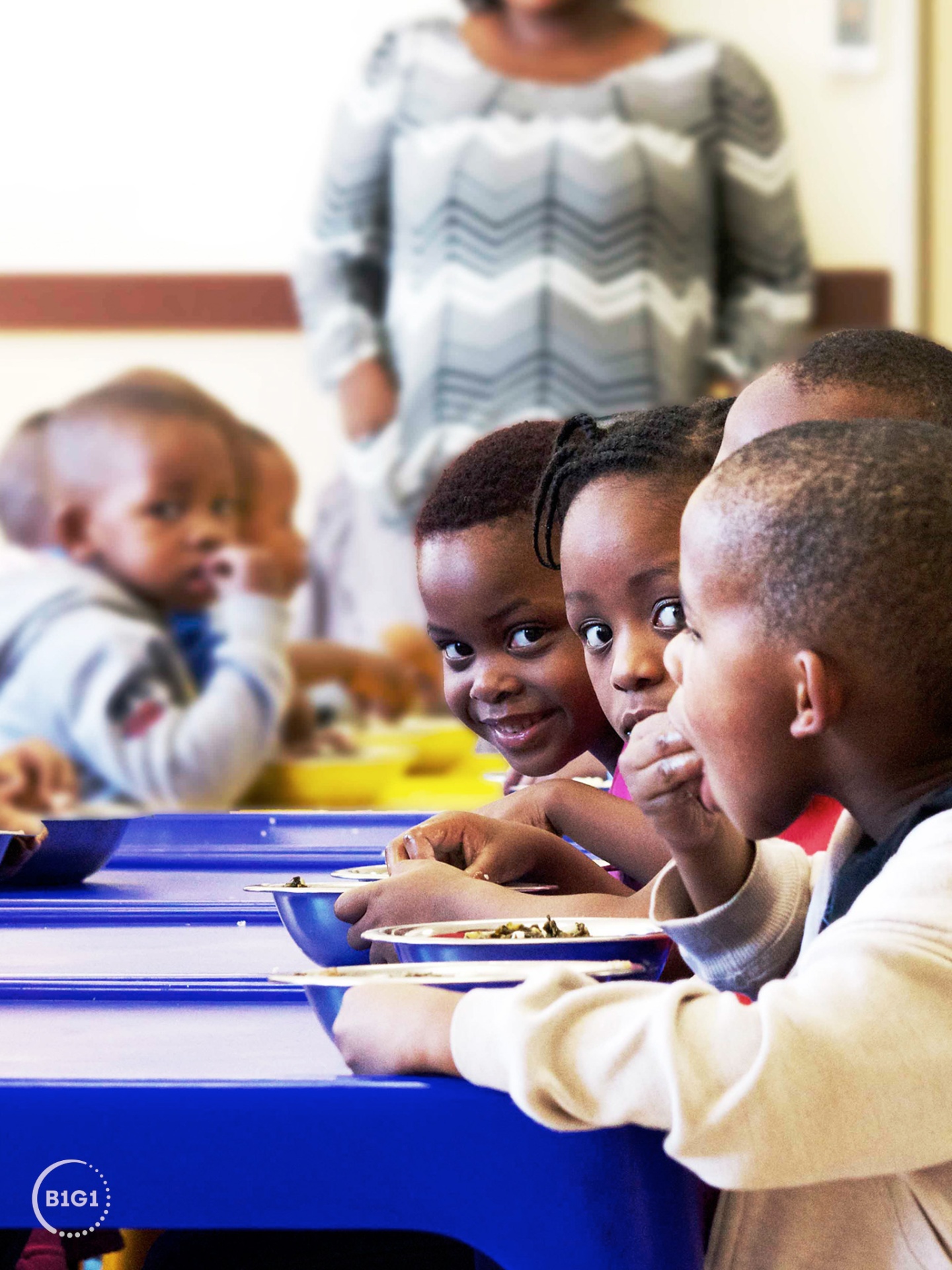 Children at a school feeding programme funded through B1G1