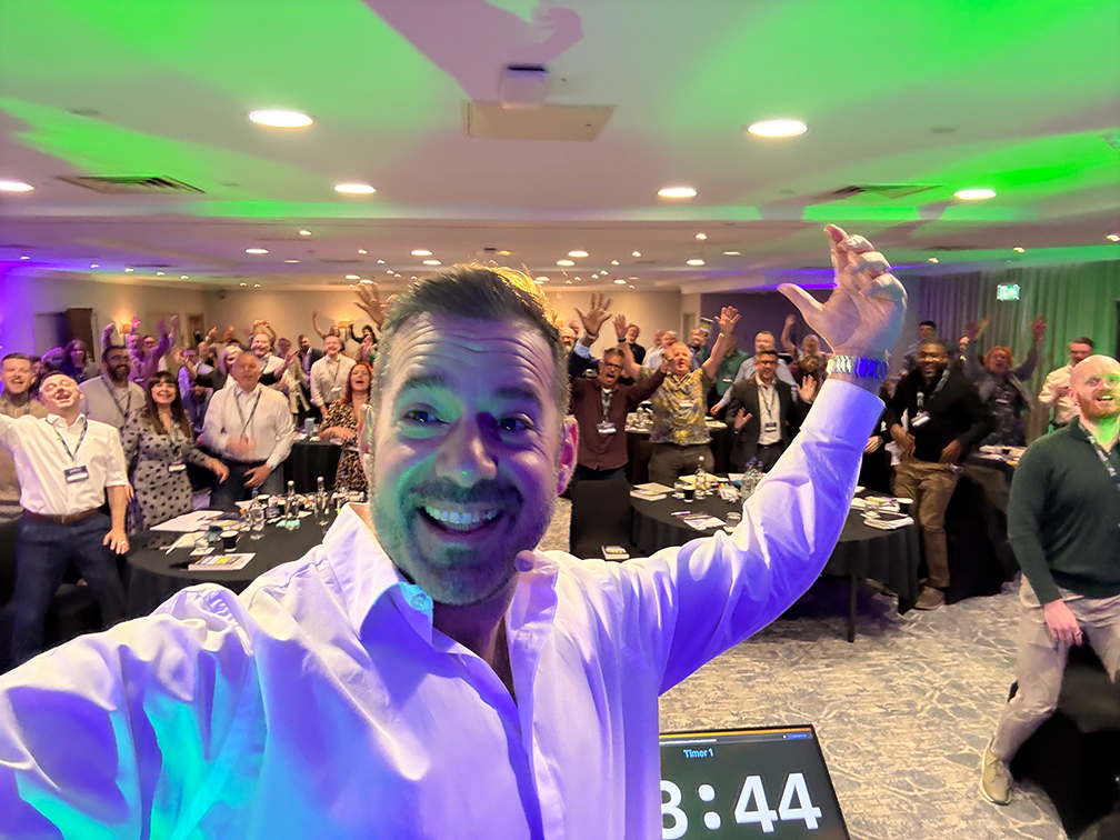 Francis Rodino delivering a keynote to a cheering audience at Scaleup Summit 2026